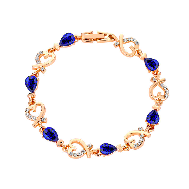 Pulsera de aleación de diamantes de flor hueca de corazón al por mayor